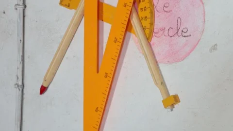 Large triangular ruler, compass and protractor in a classroom in Senegal Stock Footage 304871270