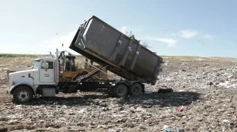 Large truck dumping trash at a county landfill HD607 Stock Footage 10918316