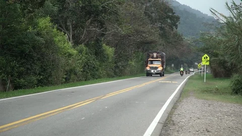 Large truck passes by on roadside Stock Footage 108548201