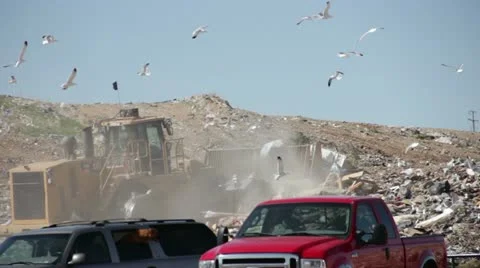 Large truck pushing garbage at county landfill HD0599 Stock Footage 10912071