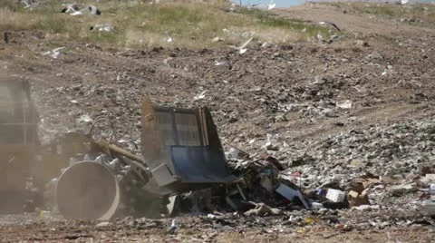 Large truck pushing trash at county landfill HD058 Stock Footage 10912054