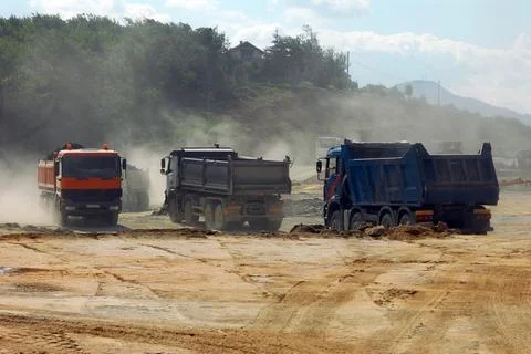 Large trucks at construction site Stock Photos