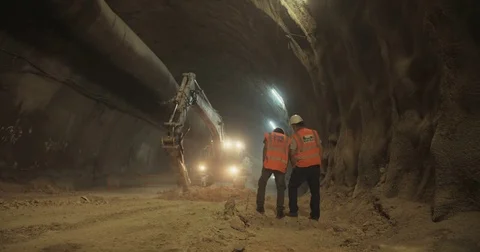 Large tunnel construction site with workers Stock Footage