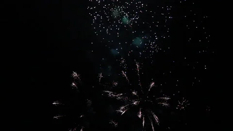 Large twinkling fireworks transition into tiny colourful fireworks Stock Footage 235223935
