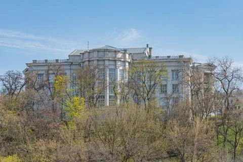 Large, two-story building with classical facade, symmetrical layout, situat.. Stock Photos
