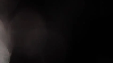 Large, two-tone, sparkling bokeh on the left in the black Video stock 318844826