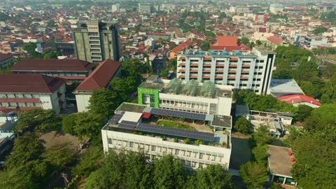 Large urban building equipped with rooftop solar energy system Stock Footage 342581293