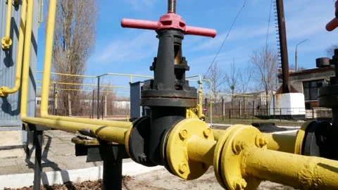 Large valve on the gas pipe. Providing gas to consumers in winter Stock Footage 202130896