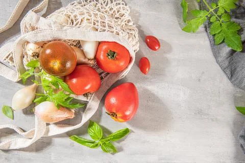 Large variety of tomatoes on rustic kitchen counter. Preparation of tomato sa Foto stock