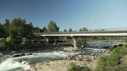 Large view of a bridge over a river with cars passing on it Stock Footage 102155624