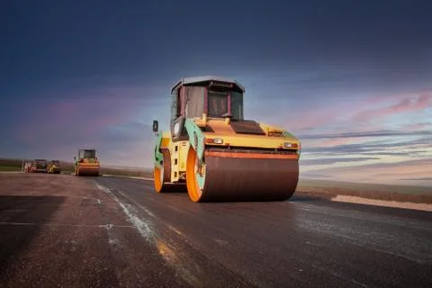 Large view on the road rollers working on the new road construction site Stock Photos