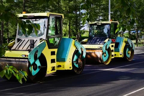 Large view on the road rollers working on the new road construction site Stock Photos