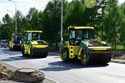 Large view on the road rollers working on the new road construction site Stock Photos