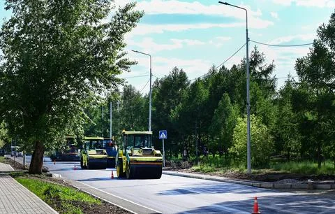 Large view on the road rollers working on the new road construction site Stock Photos