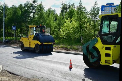 Large view on the road rollers working on the new road construction site Stock Photos