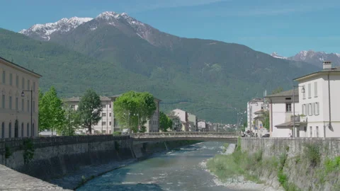 Large view of Sondrio Adda river and mountains in background Stock Footage 143780717