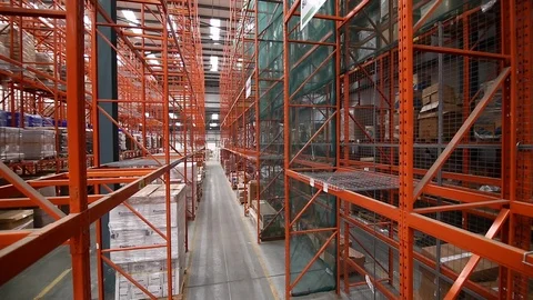 Large warehouse distribution centre shelves jib crane wide shot Stock Footage 106692340
