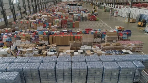 Large warehouse full of stock lined up ready for distribution, drone aerial 4K Stock Footage 101186212