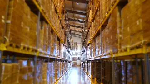 A large warehouse, with high racks, full of goods. storehouse in the enterprise Stock-Footage 81070852