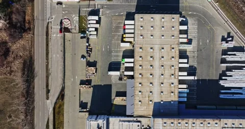 Large Warehouse System In Poor Rural Area Eastern Europe Aerial Top Down Rise Video stock 300441177