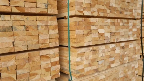 A large warehouse of timber materials, neatly folded timber in a sawmill Stockbeeldmateriaal 103894262