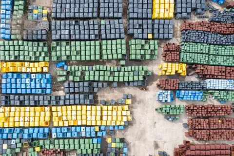 Large warehouse with trash cans. Big trash cans. City trash cans. Lots of col Stock Photos