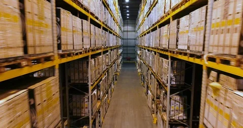 Large warehouse with white boxes, flying in a modern warehouse without people Stock Footage