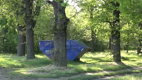 A large waste container in the woods 库存影片 153603290