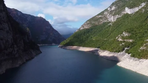 Large water channel between mountain ranges Stock Footage 167702640