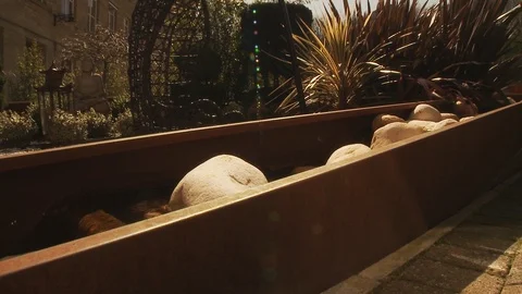 Large Water Feature in front of bar - Slider shot right to left Stock Footage 112721593