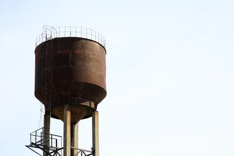 A large water tower on the background of the sky Stock Photos