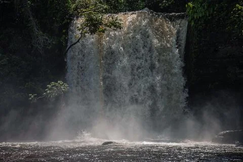 Large waterfall with choppy waters falling violently into the riverbed Stock Photos
