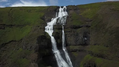 Large waterfall flowing down rocks Video stock 166859353