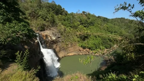 Large Waterfall Flowing into Green Pool, Tropical Jungle Landscape, Scenic Shot 스톡 동영상 324771883