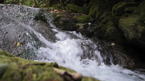 A large waterfall over some water Stock Footage 139872696