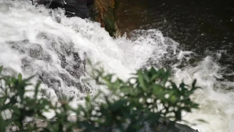 A large waterfall over some water Stock Footage 155592012