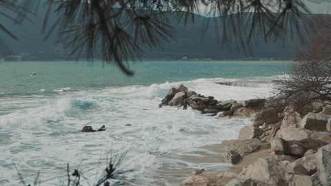 A large wave breaks on the shore Stock Footage 128684152
