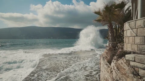 A large wave breaks on the shore Stock Footage 128684381