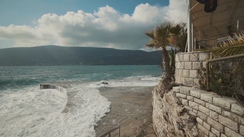 A large wave breaks on the shore Stock Footage 128684462