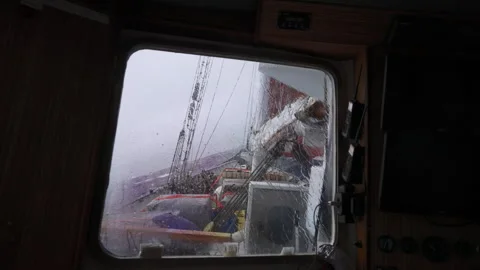 Large wave hits sailing ship in Drake Passage Video stock 337952249