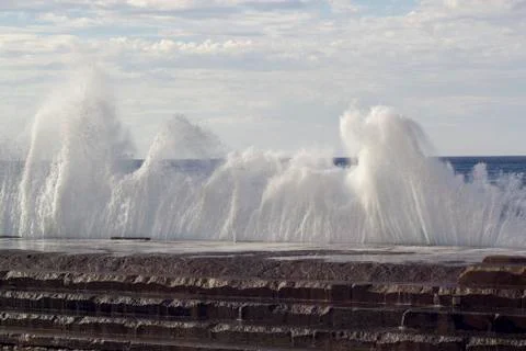 Large waves breaking on the shore Stock Photos