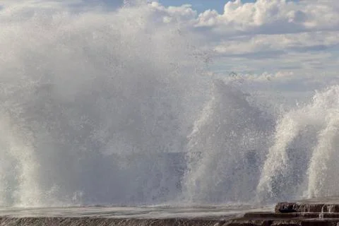Large waves breaking on the shore Stock Photos