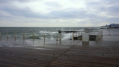 Large waves broken down with great force on the pier in slow motion Stock Footage 82524750