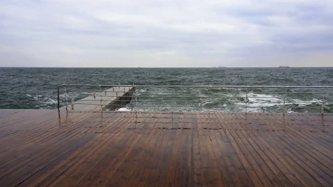 Large waves broken down with great force on the pier in slow motion Stock Footage 82526412