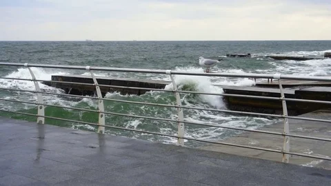 Large waves broken down with great force on the pier in slow motion Stock Footage 82530159