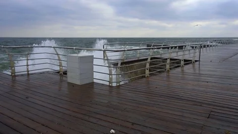 Large waves broken down with great force on the pier in slow motion Stock Footage 83098027