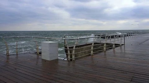 Large waves broken down with great force on the pier in slow motion Stock Footage 83774068