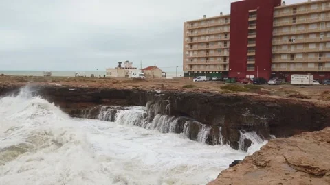 Large Waves Crash Into Rugged Cliffs Stock Footage 133804395