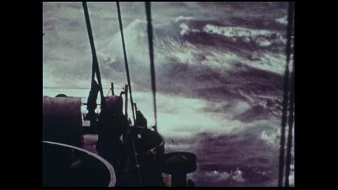 Large waves crash into a ship as it the rain keeps pouring. Stock Footage