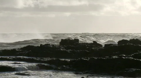 Large waves crashing over rocks in wall of spray Stock Footage 507883